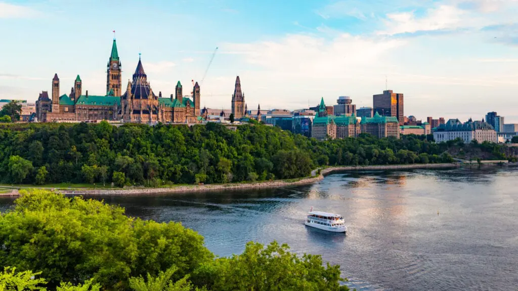 The rear of Parliament Hill is visible from the Ottawa River.
