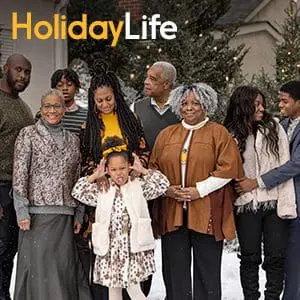 Visual of family standing in front of a snowy background with the words Holiday Life superimposed.  