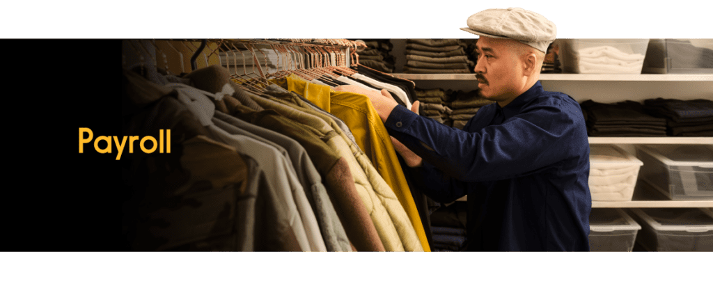 An employee looking through coat selections