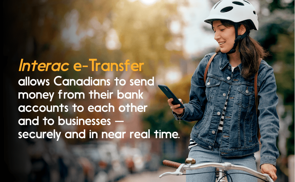 Photo of cyclist looking at smartphone. Quote: INTERAC e-Transfer allows Canadians to send moneyโฆ