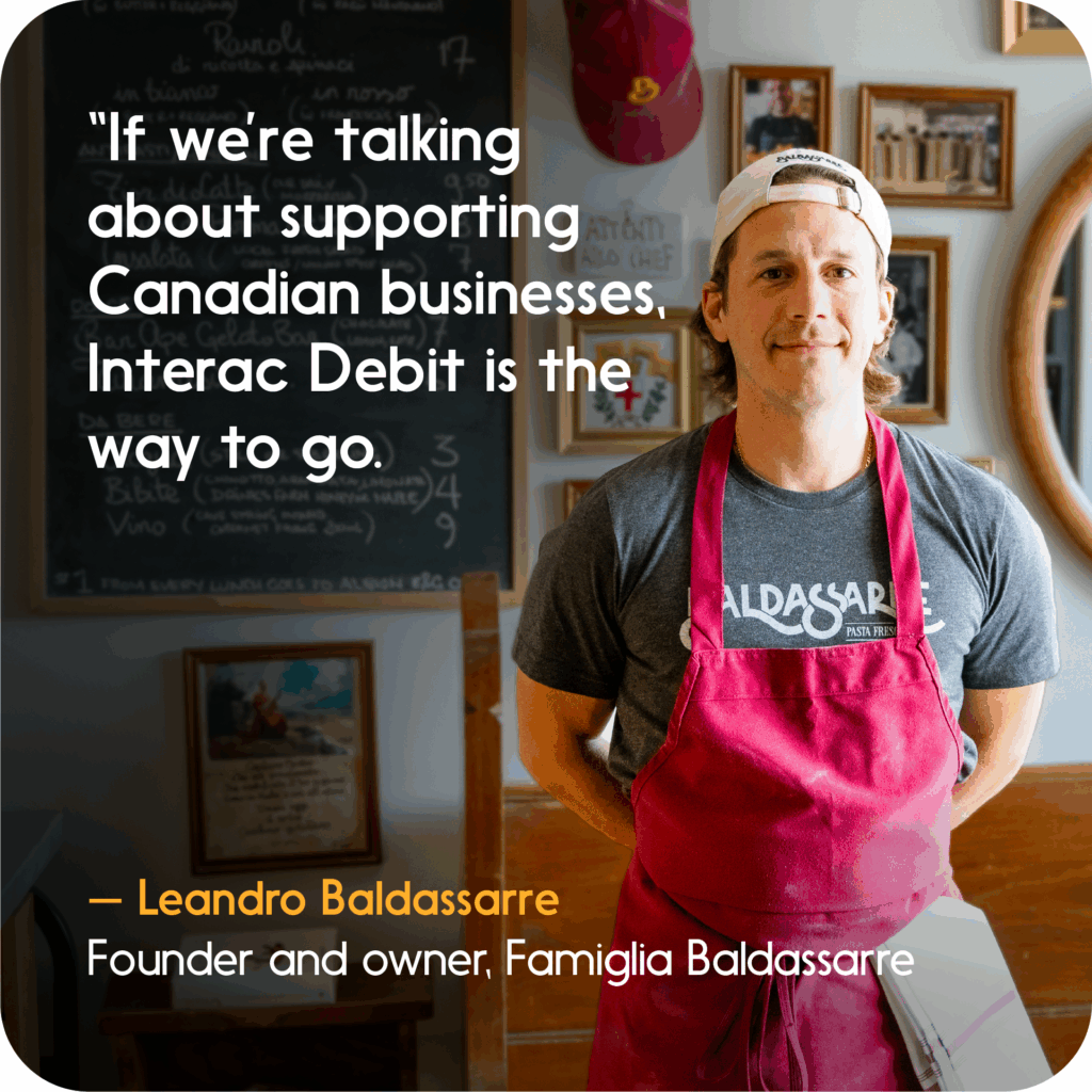 Leandro Baldassarre of Famiglia Baldassarre in his shop with quote about supporting Canadian businesses using Interac Debit.