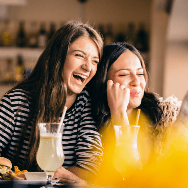 Happy friends dining at restaurant