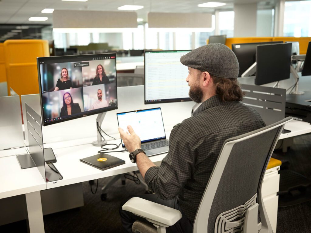 hybrid fintech employee having virtual meeting at an employer of choice in an office in Canada